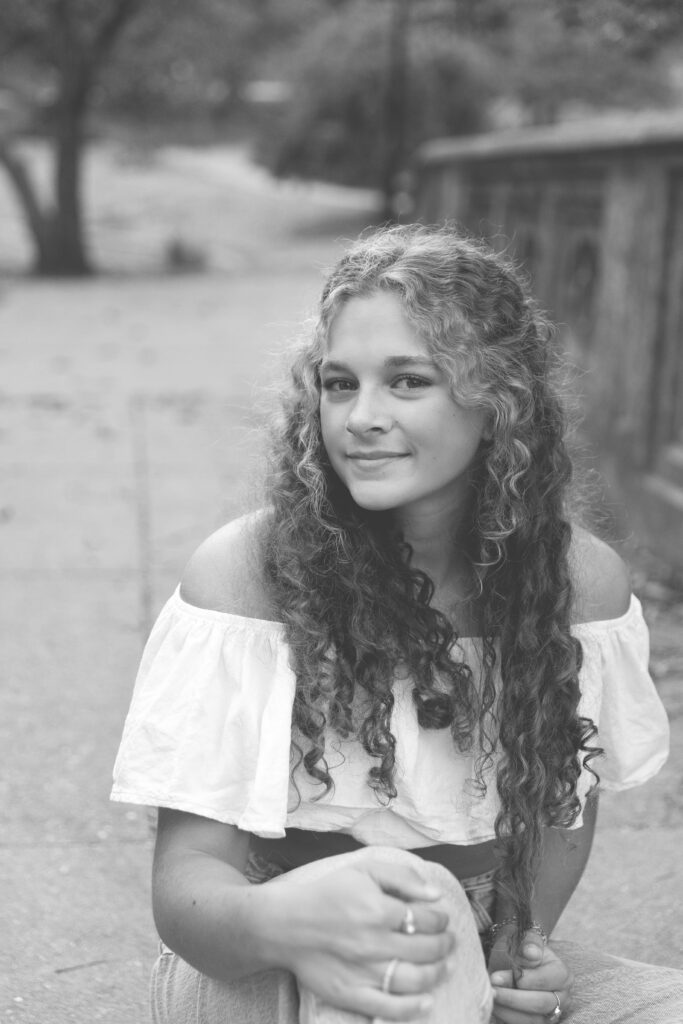 high School senior girl posing on bridge in Eden Park