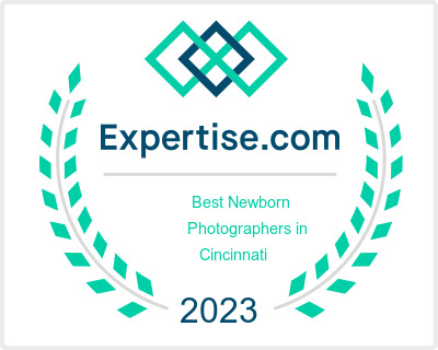 Award badge for "best newborn photographers in cincinnati 2023" from expertise.com.