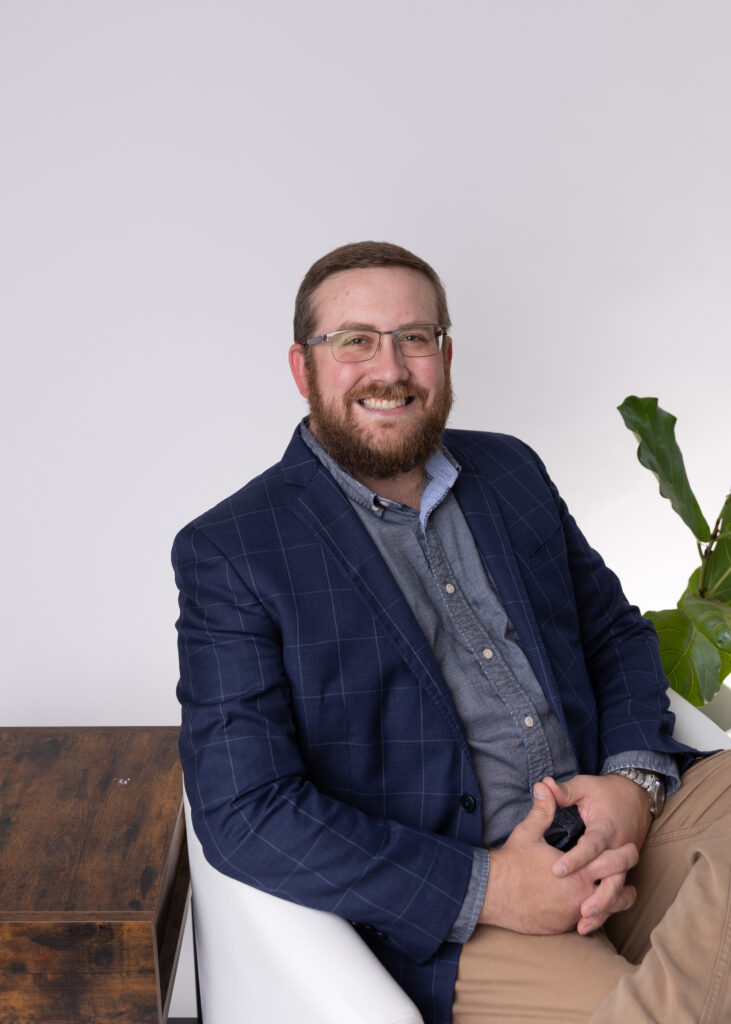 Men siting smiling posing for Headshots