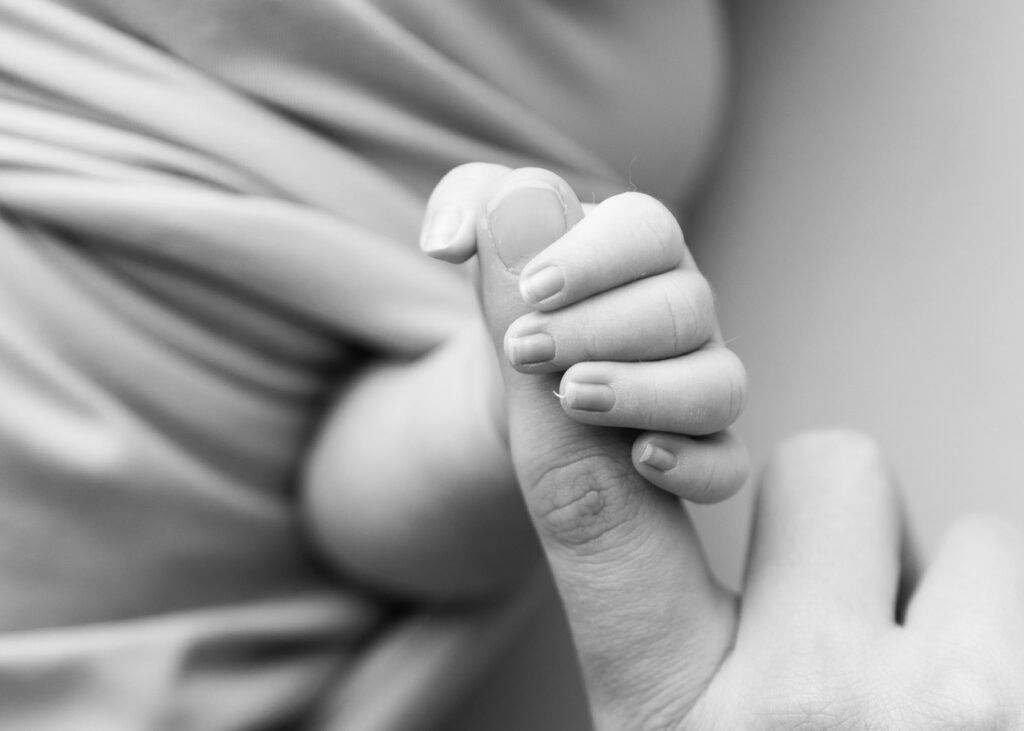 baby and mom hands