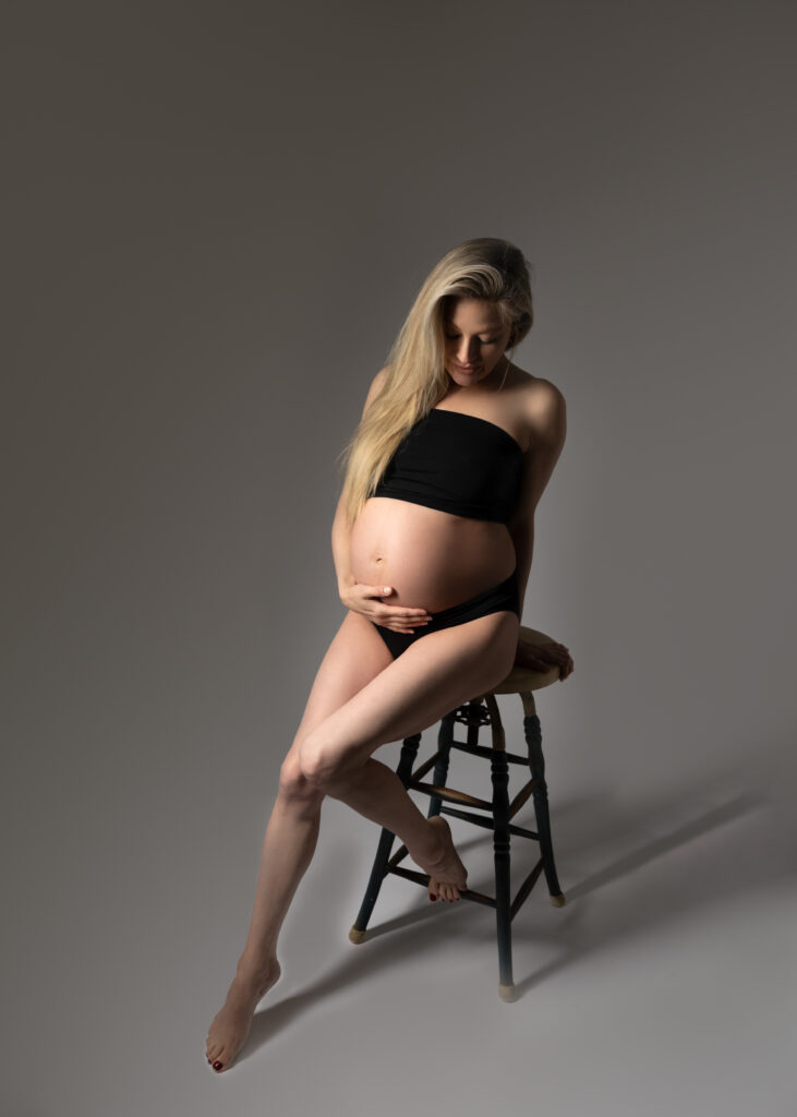 maternity photoshoot on a bar stool