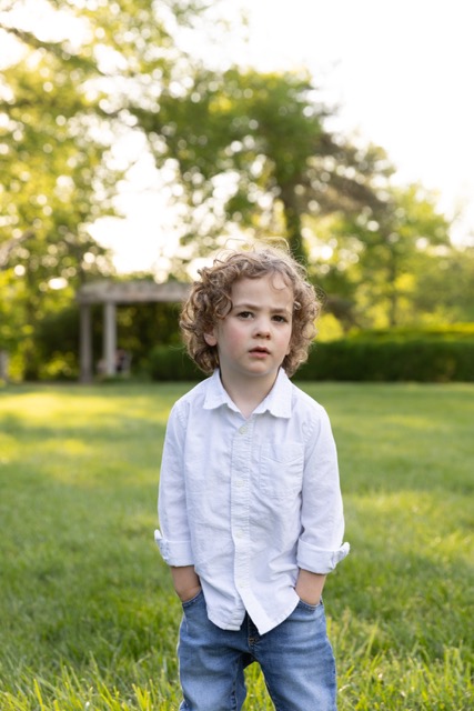 little boy posing at Ault Park during photoshoot at Ault Park