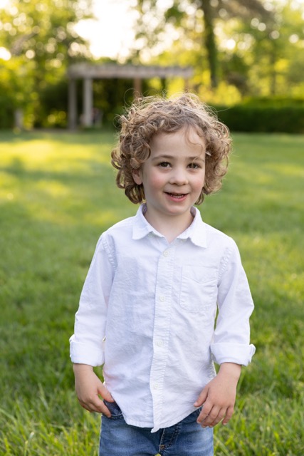 little boy posing at Ault Park during photoshoot at Ault Park