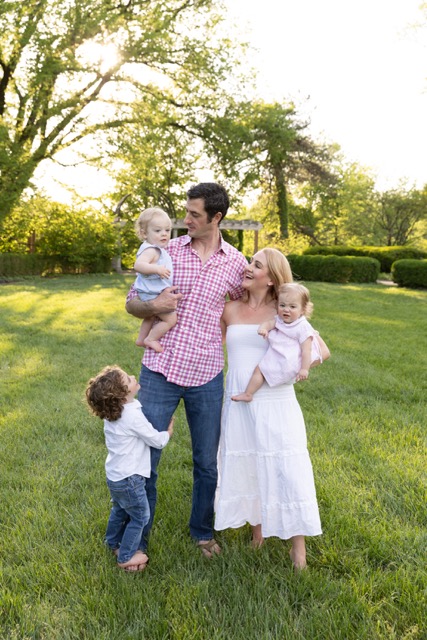 Family playing during a photoshoot at Ault Park