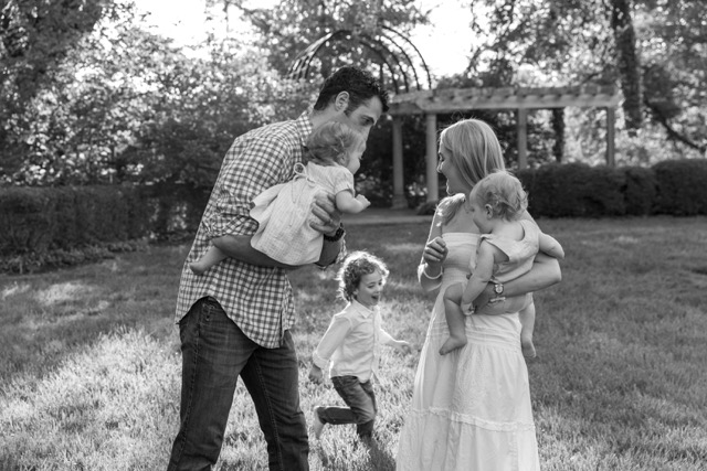 Family playing during a photoshoot at Ault Park