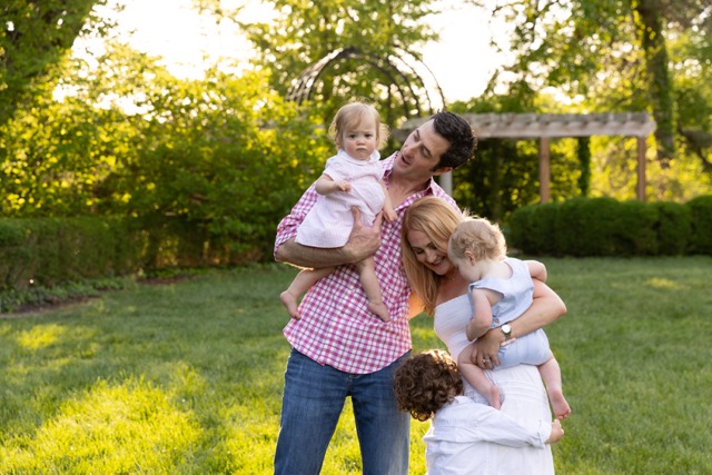 Family playing during a photoshoot at Ault Park