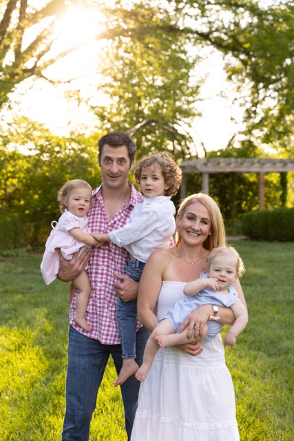 Family playing during a photoshoot at Ault Park