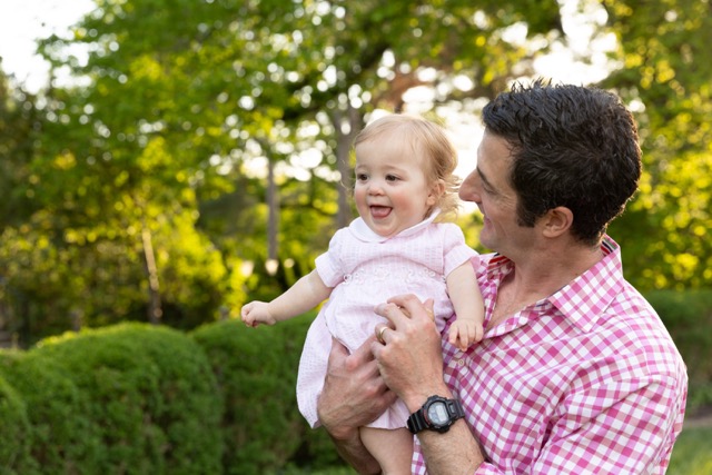 dad playing with toddler girl at Ault Park