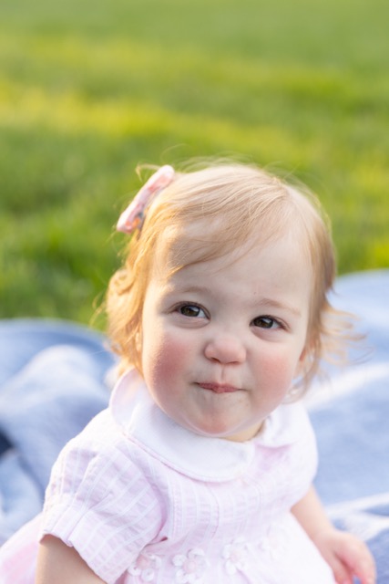 smirking toddler girl at Ault Park