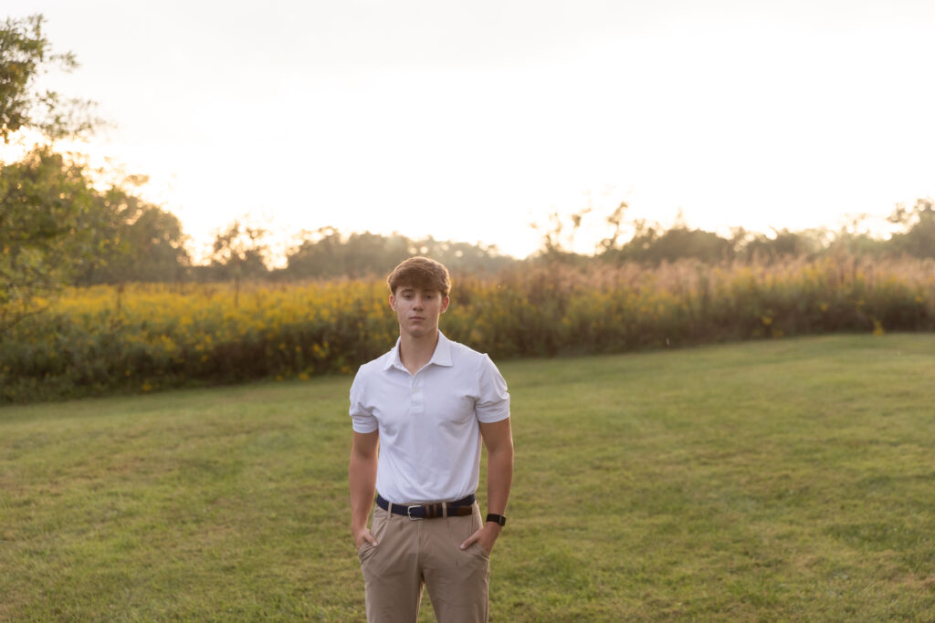 French Park sunset high school senior young men in white shirt posing for the camera